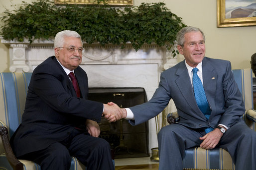 President George W. Bush shakes hands with President Mahmoud Abbas as they meet with the media Thursday, April 24, 2008, in the Oval Office of the White House. White House photo by Chris Greenberg