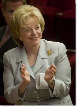 Mrs. Lynne Cheney applauds the group of naturalized American citizens as they stand to participate in the swearing in ceremony during a special naturalization ceremony at the National Archives Tuesday, April 17, 2007, in Washington, D.C.  