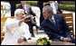 President George W. Bush listens as Pope Benedict XVI gestures as he talks about the Vatican Gardens Friday, June 13, 2008, at the Vatican. White House photo by Eric Draper