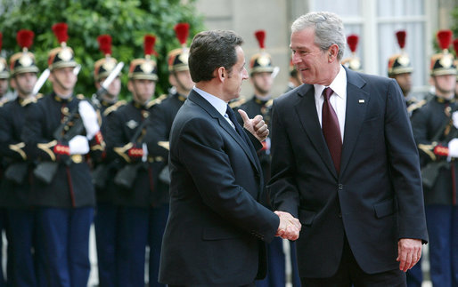 President George W. Bush is welcomed by French President Nicolas Sarkozy for a dinner Friday evening, June 13, 2008, at the Elysee Palace in Paris. White House photo by Chris Greenberg