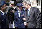 President George W. Bush spends a moment speaking with U.S. military personnel during the greeting with members of the U.S. Mission in France, Saturday, June 14, 2008, at the Ambassador's residence in Paris. White House photo by Eric Draper