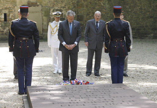 President George W. Bush pays his respects at the Mont Valerien memorial Saturday, June 14, 2008 in Suresnes, France, honoring members of the French Resistance executed by German soldiers during World War II. White House photo by Eric Draper
