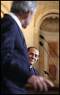 A smiling Italian Prime Minister Silvio Berlusconi listens as President George W. Bush addresses reporters at their joint press availability Thursday, June 12, 2008, at the Villa Madama in Rome. White House photo by Eric Draper