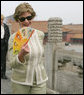 Mrs. Laura Bush finds relief from the Beijing heat in an ornamental fan during a visit Friday, Aug. 9, 2008, to the Forbidden City. White House photo by Shealah Craighead