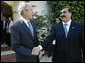 President George W. Bush and the Pakistan Prime Minister Yousaf Raza Gilani shake hands following their meeting Sunday, May 18, 2008, in Sharm El Sheikh, Egypt. White House photo by Joyce N. Boghosian