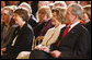 President George W. Bush and Mrs. Laura Bush listen Monday evening, Oct. 27, 2008 in the East Wing of the White House, to the performance of Theodore Roosevelt impersonator Joe Wiegand, during a celebration of the 150th birthday of Theodore Roosevelt. White House photo by Chris Greenberg