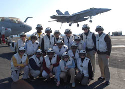 2006-2007 Fellows, in flight gear, observe operations aboard the USS Enterprise