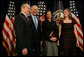 President George W. Bush smiles as he stands with Secretary of Veteran Affairs Lt. Gen. James Peake (Ret.), his wife, Janice, and daughter, Kimberly, after the former Army Surgeon General was sworn in during the ceremonial event Thursday, Dec. 20, 2007, at the U.S. Department of Veterans Affairs. White House photo by Chris Greenberg