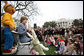 Mrs. Laura Bush, joined by her daughter, Jenna, and the PBS character "Arthur," reads the book "Arthur Meets the President," Monday, March 24, 2008, during festivities at the 2008 White House Easter Egg Roll on the South Lawn of the White House. White House photo by Shealah Craighead