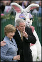 President George W. Bush embraces Mrs. Laura Bush as he blows a whistle Monday, March 24, 2008 on the South Lawn of the White House, to officially start the festivities for the 2008 White House Easter Egg Roll. White House photo by Chris Greenberg