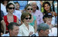 Mrs. Laura Bush is joined by her daughters, Barbara, background-left, and Jenna, background-right, as they watch action at the Tee Ball on the South Lawn: A Salute to the Troops game Sunday, Sept. 7, 2008 at the White House, played by the children of active-duty military personnel. White House photo by Joyce N. Boghosian