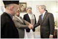 President George W. Bush meets members of President Hamid Karzai's government upon his arrival for a working lunch at the Presidential Palace in Kabul, Afghanistan Wednesday, March 1, 2006.