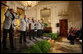 President George W. Bush joins the Temptations on stage in the East Room of the White House Tuesday, Feb. 12, 2008, after they performed during the celebration of African American History Month. White House photo by Eric Draper