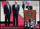 Israel’s President Shimon Peres speaks to President George W. Bush during remarks Wednesday, Jan. 9, 2008, at ceremonies welcoming him to Israel. With them is Israeli Prime Minister Ehud Olmert, center. White House photo by Chris Greenberg