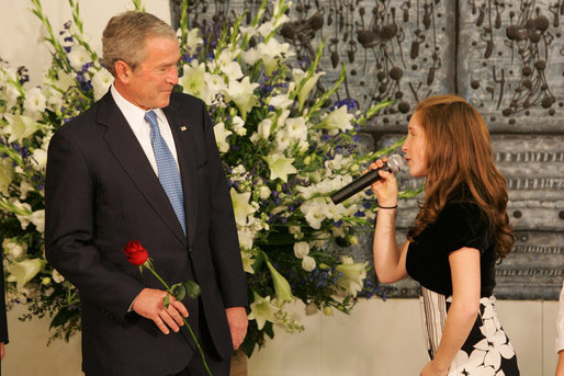 President George W. Bush listens as a young performer sings “Somewhere Over the Rainbow,” Wednesday, Jan. 9, 2008, during his meeting with the President of Israel, Shimon Peres, in Jerusalem. White House photo by Chris Greenberg