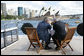 With the Sydney Opera House as a backdrop, President George W. Bush and Prime Minister John Howard of Australia, talk as they tour Sydney Harbour Wednesday, Sept. 5, 2007, aboard the MV AQA. White House photo by Eric Draper