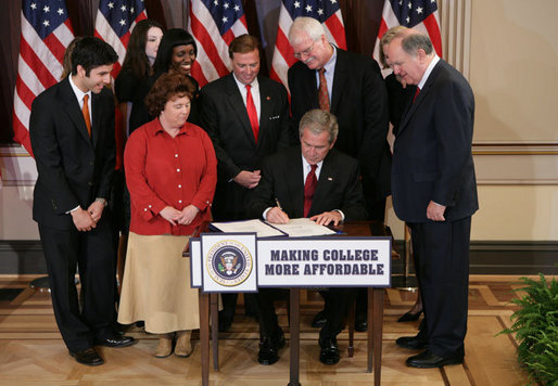 President George W. Bush signs H.R. 2669, the College Cost Reduction and Access Act, Thursday, September 27, 2007, in the Dwight D. Eisenhower Executive Office Building in Washington, D.C. The President is joined by Robert Garcia, a junior at the University of Texas, Laura Tappan, a sophomore at Northern Virginia Community College, Kalise Robinson, a junior at the University of the District of Columbia, Margie Clark, a student at Lord Fairfax Community College, Congressman Ric Keller of Florida, Congressman George Miller of California, Congressman John Spratt of South Carolina, and Secretary of Education Margaret Spellings. White House photo by Chris Greenberg