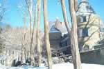 Photo of the mansion covered in snow.