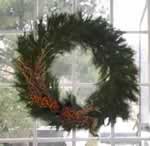Photo of wreath hanging in a window.