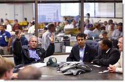 President George W. Bush speaks with federal, state and local officials at the Louisiana Emergency Operations Center in Baton Rouge, Wednesday, Sept. 3, 2008, where he was briefed in the aftermath of Hurricane Gustav. Gustav was a Category 2 storm when it made landfall Monday, in Cocodrie, La. At the request of Gov. Bobby Jindal, center, President Bush Tuesday issued a Major Disaster Declaration for 34 of the state's parishes. Baton Rouge Mayor Kip Holden listens at right. White House photo by Eric Draper