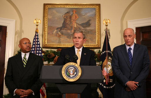 President George W. Bush is flanked by Secretary Alphonso Jackson, left, of the Department of Housing and Urban Development, and Secretary Hank Paulson of the Department of the Treasury, as he delivers a statement Thursday, Dec. 6, 2007, at the White House, on the Administration's efforts on housing. White House photo by Joyce N. Boghosian