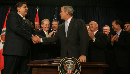 President George W. Bush shakes the hand of Peru's President Alan Garcia after signing H.R. 3688, the United States-Peru Trade Promotion Agreement Implementation Act, Friday, Dec. 14, 2007, in the Dwight D. Eisenhower Executive Office Building. In signing the agreement, the President said, "Peru and the United States are strong partners and today we're making that partnership even stronger." White House photo by Joyce N. Boghosian
