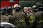 President George W. Bush thanks firefighters from the District of Columbia after they battled an early morning blaze Wednesday, Dec. 19, 2007, at the Eisenhower Executive Office Building on the White House complex. White House photo by Chris Greenberg