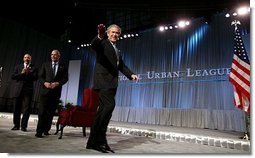 President George W. Bush waves after speaking at the 2003 National Urban League Conference in Pittsburgh Monday, July 28, 2003.  White House photo by Paul Morse