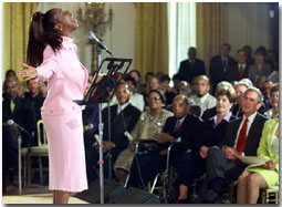 Regina Belle performs for President George W. Bush and First Lady Laura Bush during a Black Music Month celebration in the East Room of the White House on June 30, 2001. WHITE HOUSE PHOTO BY PAUL MORSE