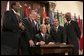 President George W. Bush signs into law the African Growth and Opportunity Act (AGOA) Acceleration Act of 2004 in the Dwight D. Eisenhower Executive Office Building Tuesday, July 13, 2004. White House photo by Paul Morse