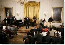 Singer KEM and his band perform a song for President George W. Bush and guests Friday, June 22, 2007 in the East Room of the White House, in celebration of Black Music Month. White House photo by Eric Draper