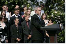 President George W. Bush delivers remarks to the 2006 and 2007 NCAA Championship teams Monday, June 18, 2007 on the South Lawn.  White House photo by Eric Draper