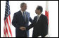 President George W. Bush and Japan's Prime Minister Yasuo Fukuda shake hands at their first meeting Sunday, July 6, 2008, at the Windsor Hotel Toya Resort and Spa in Toyako, Japan, site for this year's 2008 Group of Eight Summit. White House photo by Eric Draper