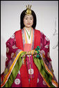 A young woman models a Junihitoe, a 12-layered formal court dress worn by women during the Heian period, during a demonstration of traditional Japanese culture Monday for G-8 spouses at the Windsor Hotel Toya Resort and Spa in Toyako, Japan. White House photo by Shealah Craighead