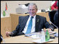 President George W. Bush relaxes prior to the start of the G8 Working Session with Africa Outreach Representatives Monday, July 7, 2008, at the Windsor Hotel Toya Resort and Spa in Toyako, Japan. White House photo by Eric Draper