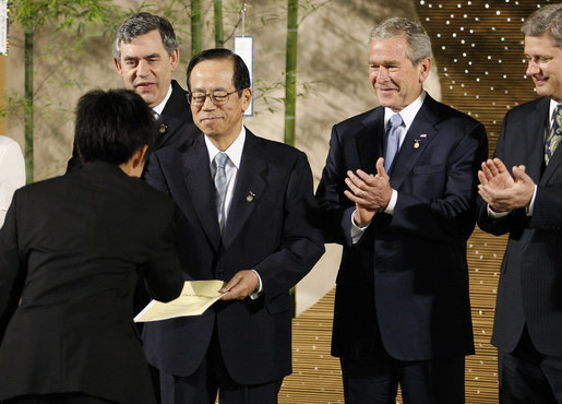 President George W. Bush leads the applause Monday, July 7, 2008, as the Japanese representative from the J-8, young leaders from the Group of Eight countries, presents credentials to Prime Minister Yasuo Fukuda of Japan, host of this year's 2008 G-8 Summit in Toyako, Japan. White House photo by Eric Draper