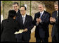 President George W. Bush leads the applause Monday, July 7, 2008, as the Japanese representative from the J-8, young leaders from the Group of Eight countries, presents credentials to Prime Minister Yasuo Fukuda of Japan, host of this year's 2008 G-8 Summit in Toyako, Japan. White House photo by Eric Draper