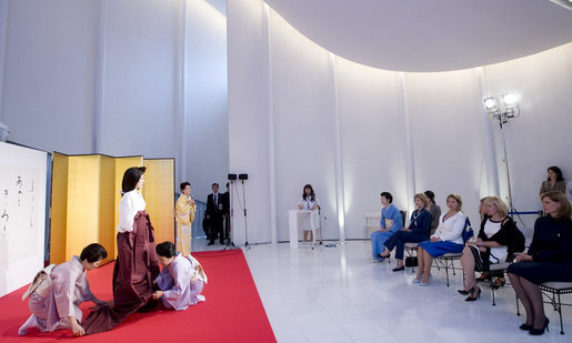 Mrs. Laura Bush joins spouses of G-8 leaders Monday, July 7, 2008, as they participate in a demonstration of a Junihitoe 12-layered Ancient Kimono at the Bridal Chapel and Bridal Salon of the Windsor Hotel Toya Resort and Spa in Toyako, Japan. The event celebrates the 1000th anniversary of the Tale of Genji, a Japanese classic written by Lady Murasaki. Junihitoe means 12 layers, and is an example of the formal court dress worn by women during Murasaki’s time. White House photo by Shealah Craighead
