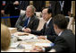 President George W. Bush exchanges handshakes with Prime Minister Yasuo Fukuda of Japan, Tuesday, July 8, 2008, as the G-8 leaders began their morning working session at the Windsor Hotel Toya Resort and Spa in Toyako, Japan. White House photo by Eric Draper