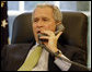 President George W. Bush speaks to Colombia's President Alvaro Uribe Velez after the announcement Thursday, July 2, 2008, by the Colombia's military that it had rescued 15 hostages, including former presidential candidate Ingrid Betancourt and three U.S. military contractors, from leftist rebels. White House photo by Eric Draper