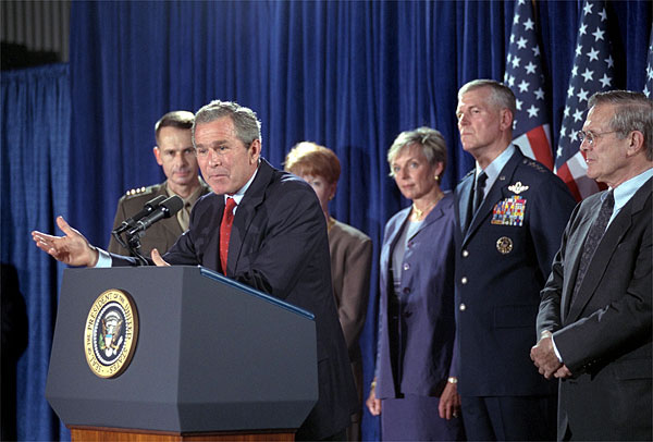 With Secretary of Defense, Donald Rumsfeld by his side, President Bush announces that General Richard B. Myers, center, will be the Chairman of the Joint Chiefs and General Pete Pac, far left, will serve as Vice Chairman of the Joint Chiefs during a press briefing at the Crawford Community Center, Aug. 24. White House photo by Moreen Ishikawa.