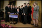 President George W. Bush is joined by legislators Wednesday, Feb. 8, 2006 at the signing ceremony for S. 1932, The Deficit Reduction Act of 2005, in the East Room of the White House. White House photo by Eric Draper