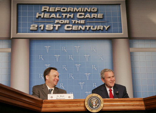 President George W. Bush joins Dr. Mark McClellan, administrator of the Centers for Medicare and Medicaid Services, at a panel discussion Thursday, Feb. 16, 2006 on health care initiatives at the U.S. Department of Health and Human Services in Washington. White House photo by Kimberlee Hewitt
