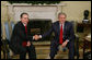President George W. Bush welcomes President Alvaro Uribe of Colombia to the Oval Office, Thursday, Feb. 16, 2006. White House photo by Paul Morse