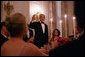 President George W. Bush offers a toast to his guests Tuesday evening, Feb. 14, 2006 during a Valentine's Day social dinner in the State Dining Room at the White House. White House photo by Kimberlee Hewitt