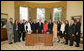 President George W. Bush poses with members of President's Council on Service and Civic Participation, Tuesday, Feb. 14, 2006 in the Oval Office of the White House. The council, created by the USA Freedom Corps in 2003, promotes volunteerism and recognizes Americans who serve our communities and the world. White House photo by Paul Morse