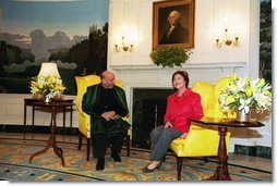 Laura Bush welcomes President Hamid Karzai of Afghanistan to the White House during a meeting in the Diplomatic Reception Room Thursday, Feb. 27, 2003.  White House photo by Susan Sterner