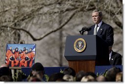 Speaking to the memory of the seven astronauts who lost their lives in Space Shuttle Columbia disaster, President George W. Bush addresses the nation's loss during a memorial service at the NASA Lyndon B. Johnson Space Center Tuesday, Feb. 4, 2003. "This cause of exploration and discovery is not an option we choose; it is a desire written in the human heart. We are that part of creation which seeks to understand all creation," said the President. "We find the best among us, send them forth into unmapped darkness, and pray they will return. They go in peace for all mankind, and all mankind is in their debt."   White House photo by Paul Morse