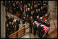 The casket of former President Gerald R. Ford is carried by military pallbearers to the front of the National Cathedral during his State Funeral in Washington, D.C., January 2, 2007. White House photo by Paul Morse