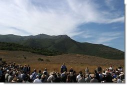 As hills in the Santa Monica Mountains National Recreation Area roll through the landscape, President George W. Bush delivers remarks with Secretary of the Interior Gale Norton in Thousand Oaks, Calif. File photo.  White House photo by Paul Morse